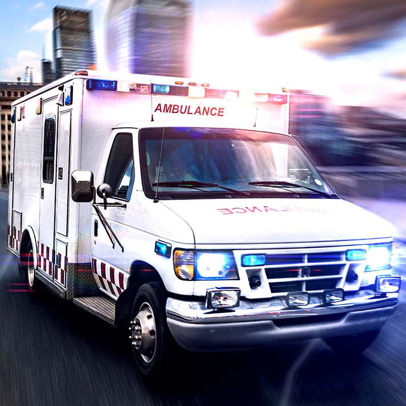 image of an ambulance with it's lights on